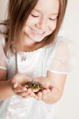 Happy Princess Girl Holding a Frog, Fairy Tale Magic