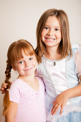 Happy Sisters Dressed as Princesses