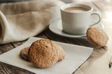 Almond cookies on the wood table. Romantic composition