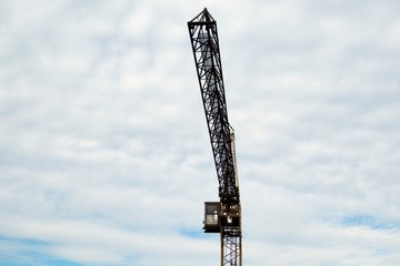 Crane boom against the sky. 