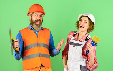 Pick color. DIY repair. Construction workers. Home renovation. Cheerful couple renovating house....