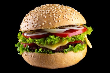 Burger against black background and sandwich hamburger with beef cheese,  fast.