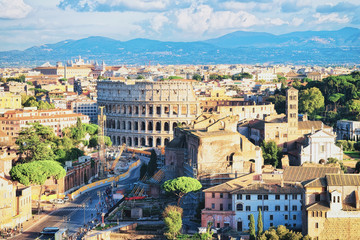 Fototapeta na wymiar Via dei Fori Imperiali and Colosseum at Rome city center