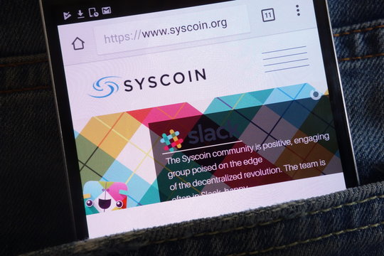KONSKIE, POLAND - JUNE 02, 2018: Syscoin cryptocurrency website displayed on smartphone hidden in jeans pocket