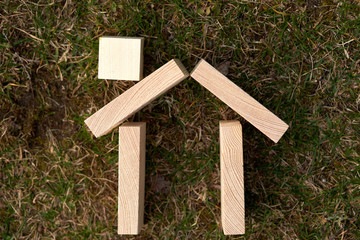 Wooden blocks in a shape of a house can be used as copy space or use for concepts