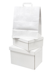 Pile of blank white paper boxes and paper bag packages isolated on white background. Stack of white various packages