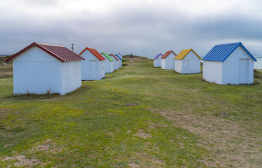 Gouville, France - 12 30 2018: Colorful bathing cabins of Gouville