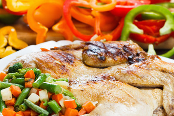 Chicken cooking with a crust on the grill