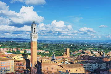 Fototapeta na wymiar Cityscape with Torre del Magnia Tower Piazza Campo Square Siena