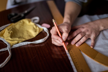 cutting the cloth to prepare the drape