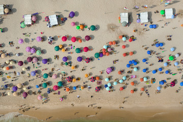 Fototapeta na wymiar Aerial view of umbrellas on the beach in Rio de Janeiro