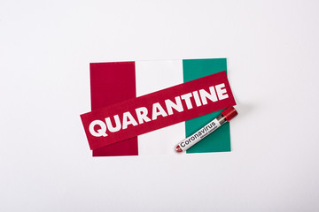 top view of test tube with blood sample near quarantine lettering on italian flag on white