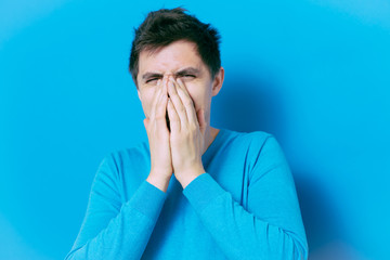 man laughs and covers her mouth