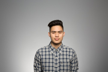 Fototapeta premium Studio portrait of a pensive young man