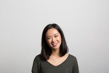Obraz premium Studio portrait of a thoughtful young woman