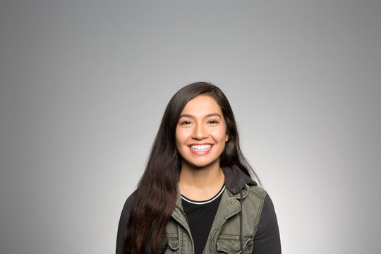 Studio portrait of an excited young woman 