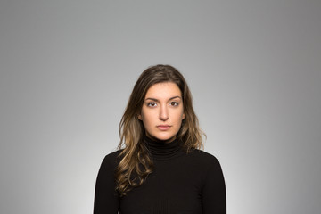 Obraz premium Studio portrait of a thoughtful young woman 