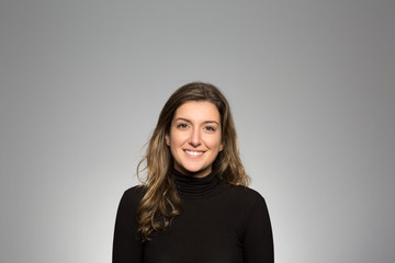 Obraz premium Studio portrait of a happy young woman
