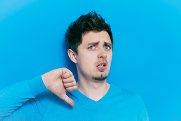 Naklejka premium man showing a thumb down gesture