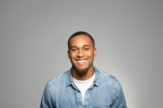 studio portrait of an excited young man 
