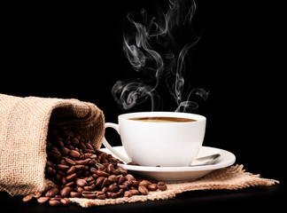 Coffee beans in a bag and a cup with coffee