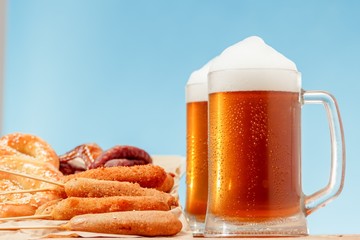 Beer glass alcohol drink with food sausage, meal view.
