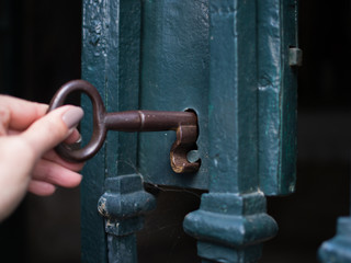 Hand hold key opening locked gate