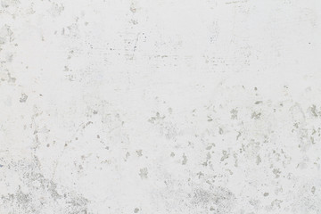 The wall with white ragged paint. Background.