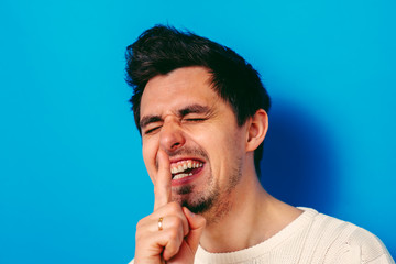 man put finger on her lips