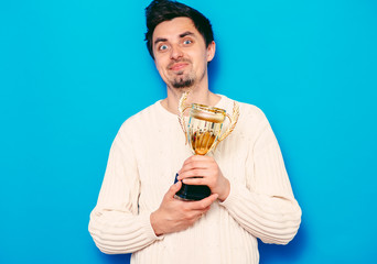 man with a golden cup