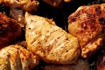 Chiken barbeque on a grill roasting open fire spring summer time