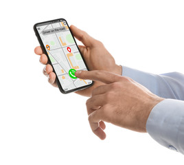Man ordering taxi with smartphone on white background, closeup