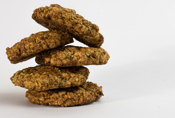 Fototapeta na wymiar Cookies oatmeal nuts on a plate close-up on a white background