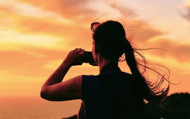 Sunrise or sunset and young girl and Capo Ferro in reflex