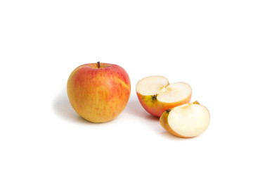 Whole, half and quarter apple on a white isolated background. Vegetarian food. Fresh fruits.