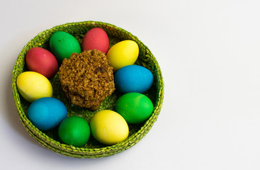 Easter eggs in a basket and nut cookies