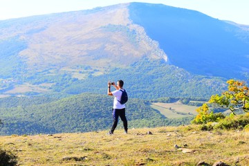 hiker on the top of mountain