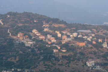 Alanya. Turkey. View of the residential neighborhoods popular resort town on the Anatolian coast. Dusk. Bird's-eye view.