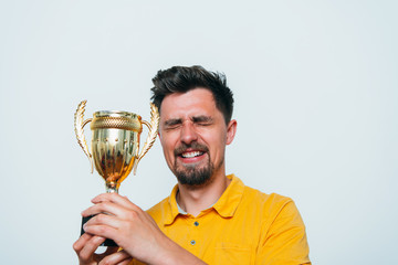 man with a golden cup