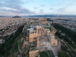 Fototapeta na wymiar Aerial view of Acropolis of Athens, the Temple of Athena Nike, Parthenon, Hekatompedon Temple, Sanctuary of Zeus Polieus, Odeon of Herodes Atticus, Erechtheion at sunset