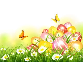 Fototapeta na wymiar Colorful Easter Eggs in Grass and Butterflies