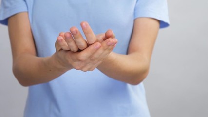 close-up of arms cleaning with antibacterial hand sanitizer while pandemic season