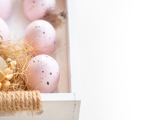 Pink eggs and Easter holiday banner with white copy space. Rustic style home decoration.