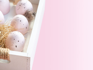 Pink eggs and Easter holiday banner with copy space for text. Rustic style home decoration. Pink background.