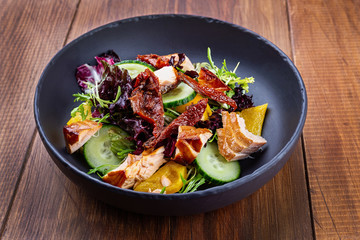 Tuna salad in a black bowl