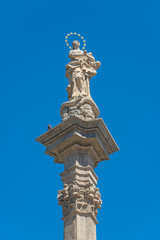 Fototapeta na wymiar Statues at Marian Column or Holy Trinity at Hradcanske Square for bubonic plague pandemics in Prague, Czech Republic, details, closeup