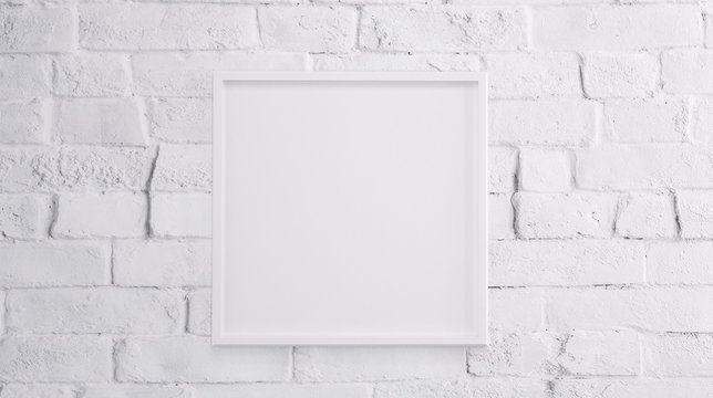 White blank frame over white brick wall 3d rendering illustration