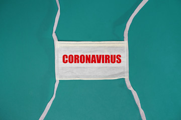 Isolated medical mask on blue background. Medical mask isolated on blue background. Coronavirus and...