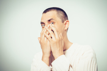 man laughs and covers her mouth