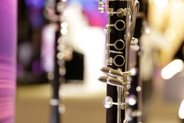 A closeup view of a clarinet instrument on display.